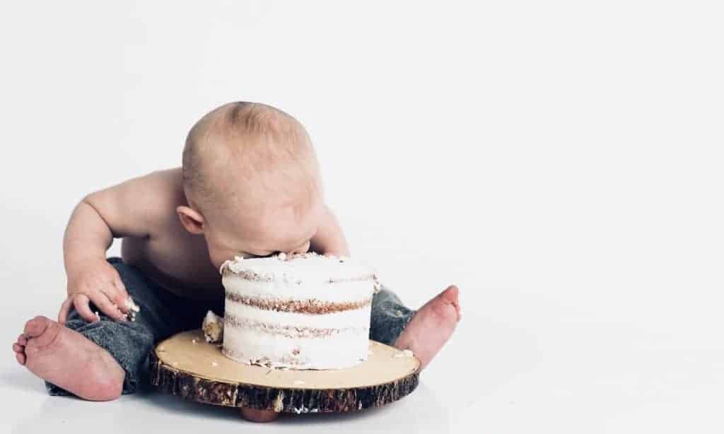 Vegan baby eating cake